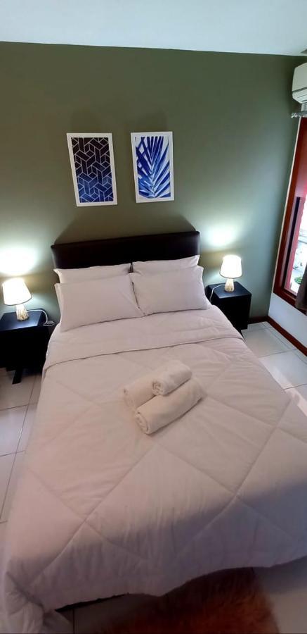 Bliss Hoteis Centro Búzios Eksteriør billede A bed with a duvet